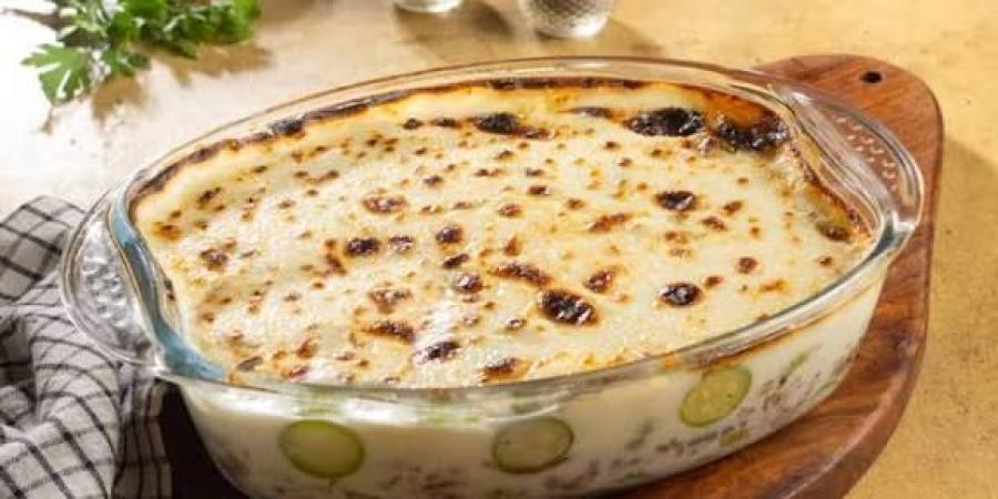 طريقة عمل طاجن الكوسة بالبشاميل.. طعم بيتي غني ومميز - الفجر سبورت